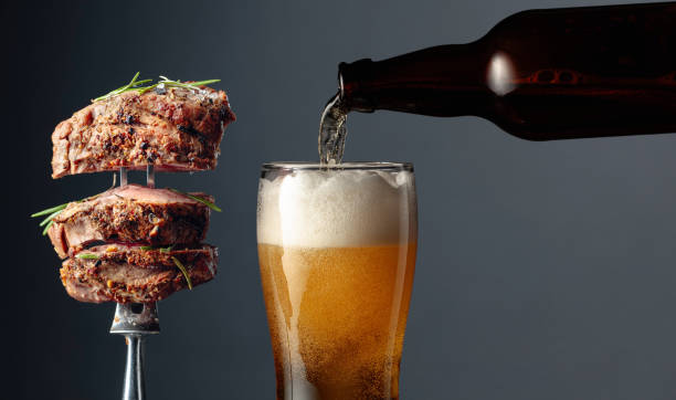 beer and grilled ribeye beef steak. - food and drink steak meat food imagens e fotografias de stock