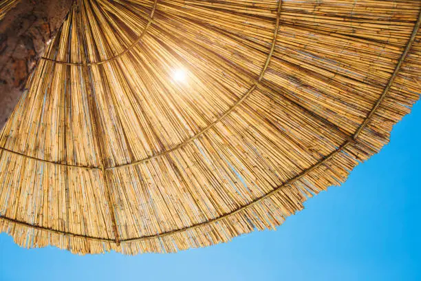 Bottom view of a beach umbrella - shade from the bright sultry sun - preventing sunburn