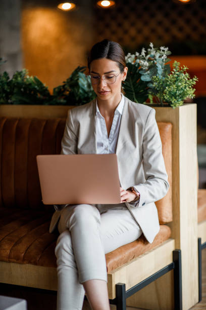 istock Successful businesswoman working laptop at cafe 1368933661