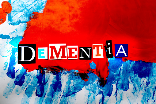 Dementia headline from paper letters on colorful  background. Medical concept.