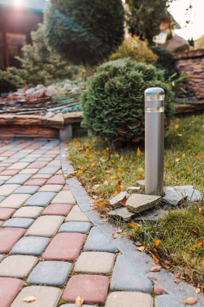 istock Street lamp lighting along the path in the yard 1368936066