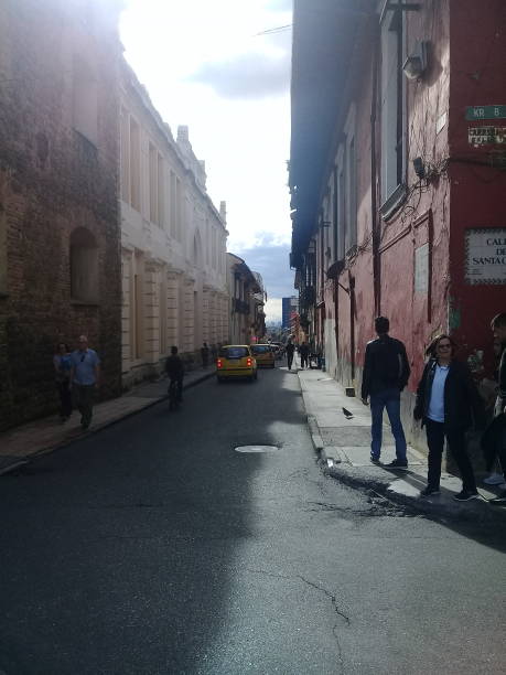 People walking by the streets of Bogota's downtown during a cloudy morning of autumn. Shot in Bogotá City, Cundinamarca, Colombia.