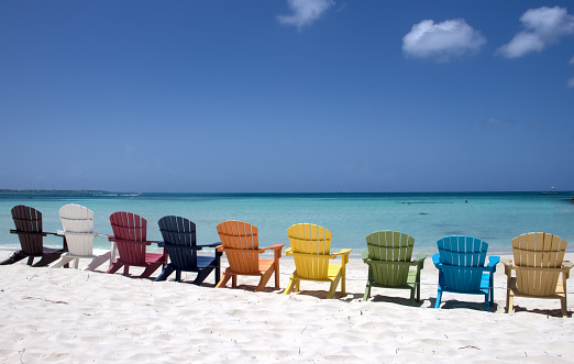 Colorful beach chairs on caribbean coast