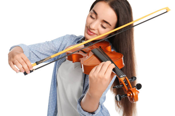 istock Beautiful woman playing violin on white background, focus on hand 1368938198