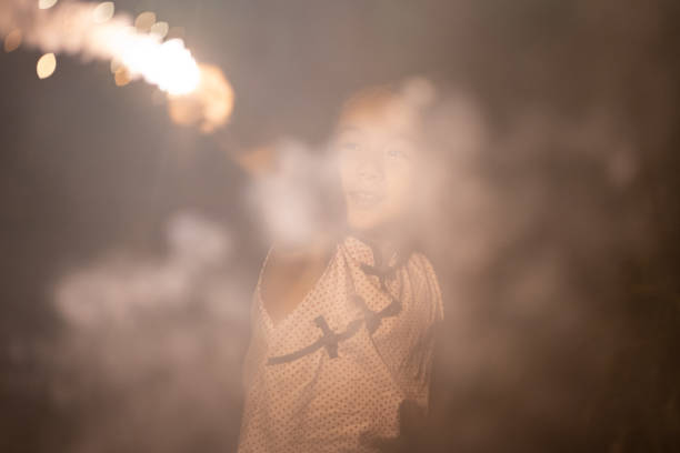 istock Little Girl Playing Fireworks 1368943864
