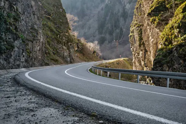 Photo of S curve, asphalt road bend