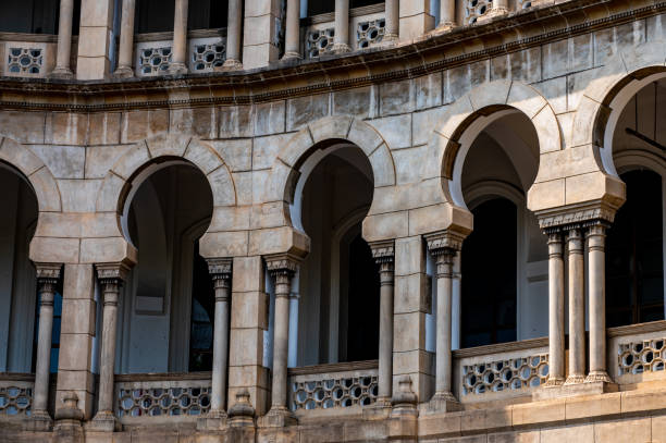 Close-up of a building with arch windows in a row. The Old KL Railway Station is one of Kuala Lumpur's most famous landmarks.