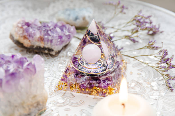 istock Small altar with Orgonite or Orgone pyramid in home interior. Converting negative energy to positive energy and have healing powers. 1368945182