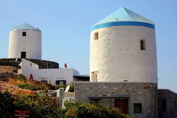 Old traditional windmills renovated and used as apartments at Kastro village, Sifnos island, Greece, August 27 2010.
