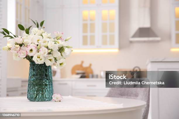 Bouquet Of Beautiful Flowers On Table In Kitchen Space For Text Interior Design Stock Photo - Download Image Now