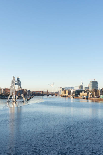 Berlin, Germany - December 26, 2021: view of the Oberbaunum Bridge and TV tower and the Spree river from the Elsen Bridge , Molecule Man