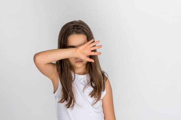 istock Child girl closing his eyes by hand 1368948530