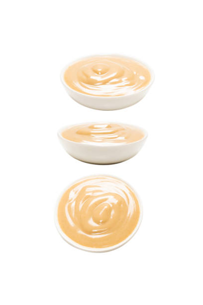 istock Mushroom sauce in a bowl isolated on white background. 1368948808