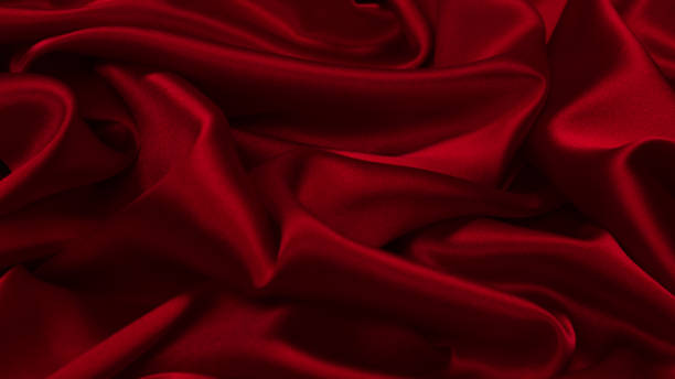 istock Rich and luxury red silk fabric texture background. 1368948815