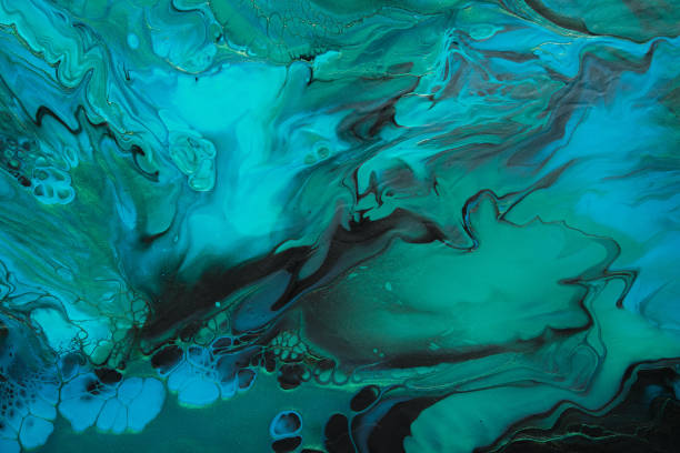 istock Fluid Art. Green and blue abstract wave swirls on black background. Marble effect background or texture 1368948984