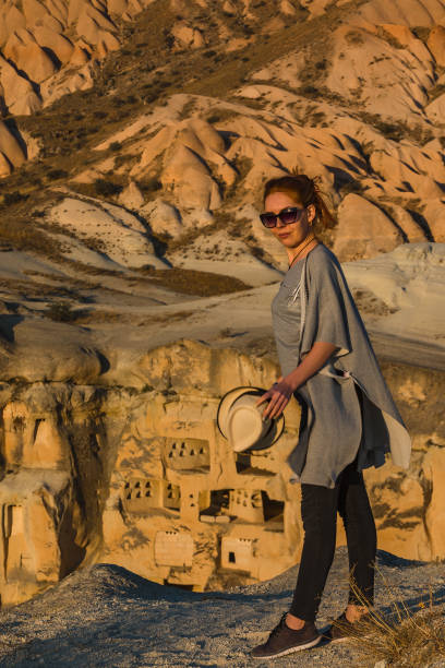 istock Rock Formation, Redhead Woman at Cappadocia 1368949832