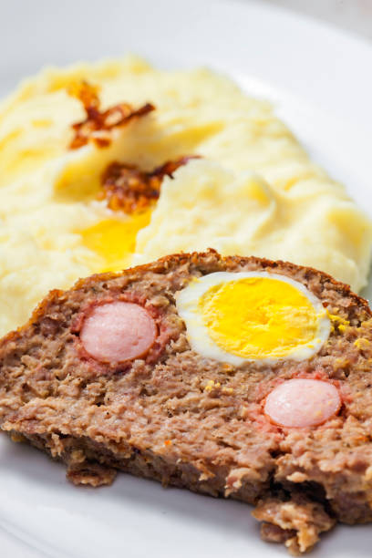Slices of Gala pie - pork pie with egg - white background