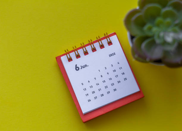 istock Desktop calendar for June 2022 on a yellow background. 1368952687