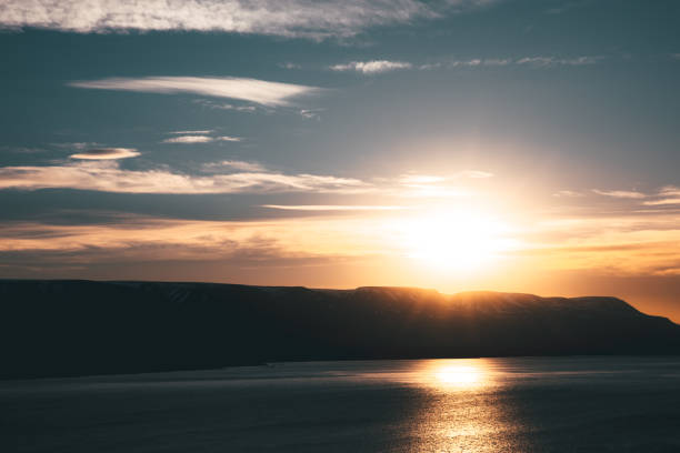 Akureyri Fjord Sunset, Northern Iceland. Moody midnight sunset twilight over Mountain Range close to the Akureyri Fjord in Northern Iceland. Akureyri, Northern Iceland, Iceland, Northern Europe