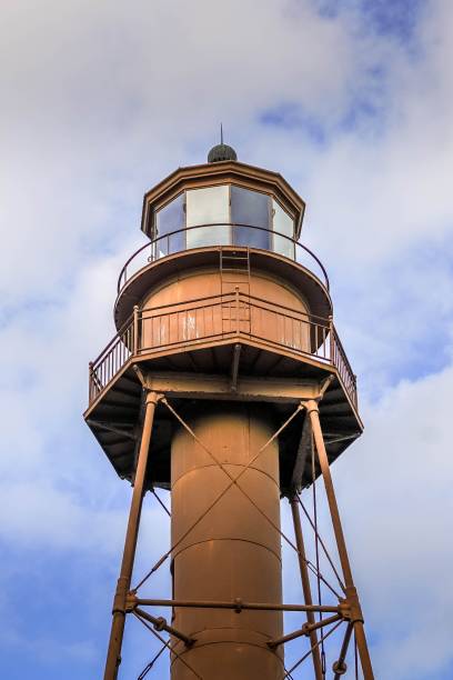 Lighthouse on Sanibel Island in Florida surrounded by blue sky and puffy white clouds Sanibel Island Lighthouse in Florida sanibel island stock pictures, royalty-free photos & images