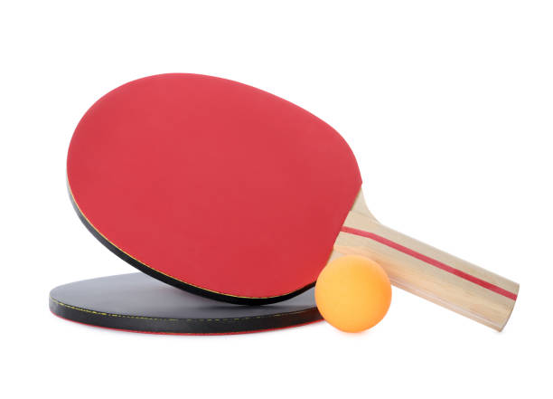 istock Orange plastic ball and rackets for table tennis on white background 1368954677