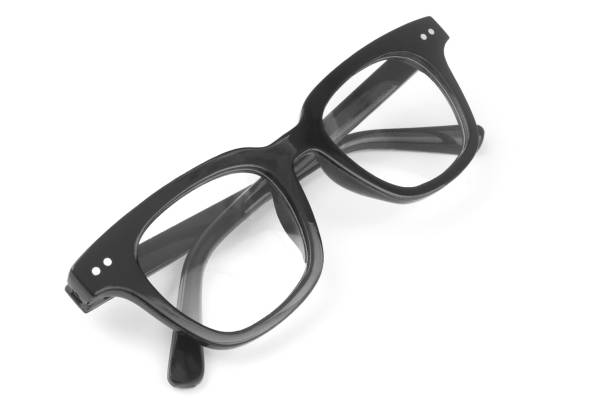 Close-up of eyeglasses against blue background.