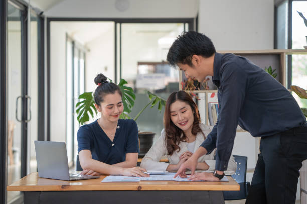 istock Young business team working with business report document on office desk. 1368954801