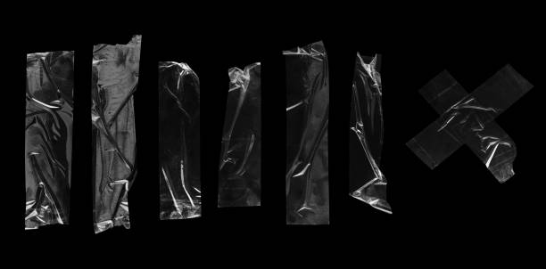 istock Transparent adhesive tapes isolated on black 1368954909
