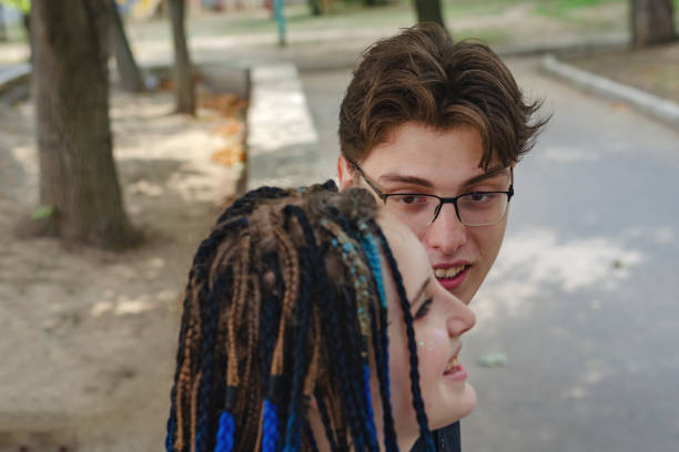 Studio portrait of an adult heterosexual couple against a white background