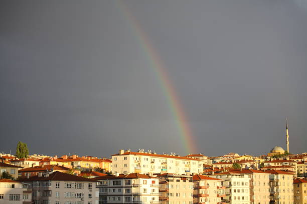 istock Rainbow Behind City Buildings and Mosque 1368956490