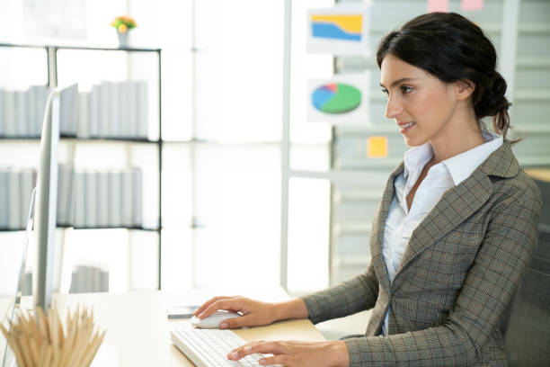 istock Young business woman operator use computer in the office, business successful concept 1368956582