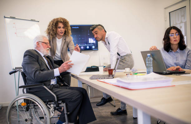 istock disabled businessman in a a wheelchair at work 1368956825