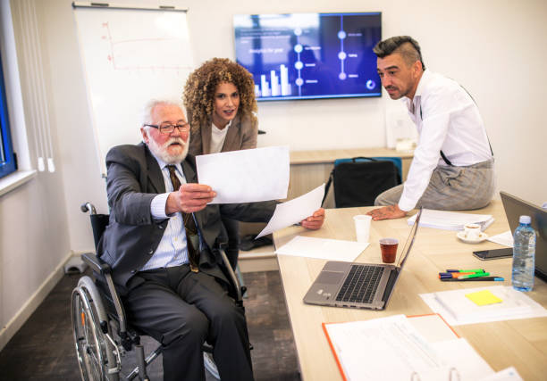 istock disabled businessman in a a wheelchair at work 1368956847