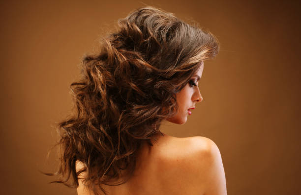 istock Beautiful model female with wavy hairstyle 1368962502