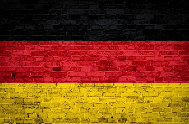 istock Germany flag painted on old grunge brick wall 1368964643