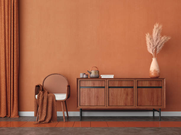 istock Orange room with chair,table,pampas and orange wall background.3d rendering 1368965932
