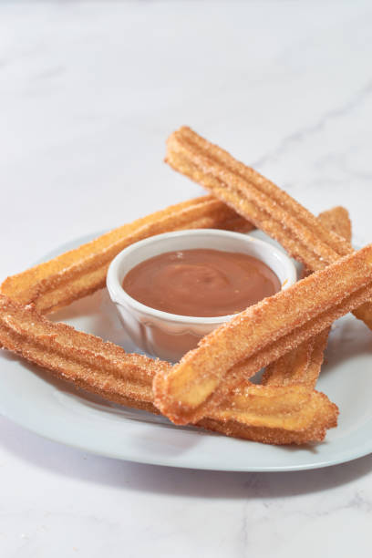 istock Mexican churros served on a homemade plate. 1368966973