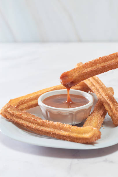 istock Homemade Spanish churros with sugar and cinnamon. 1368966982