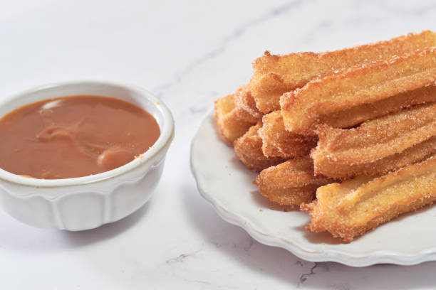 istock Homemade Spanish churros with sugar and cinnamon. 1368966993