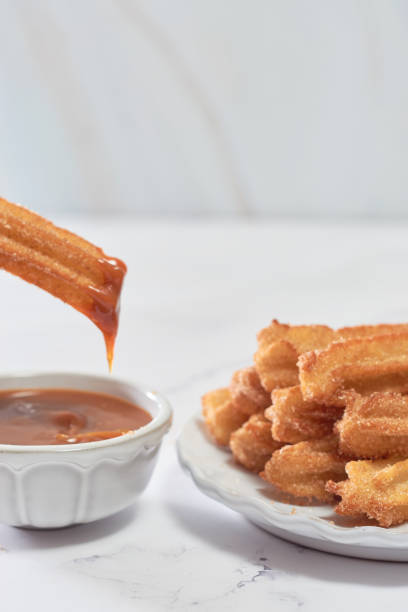 istock Mexican churros served on a homemade plate. 1368966995