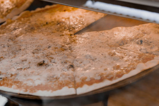 istock Pizza. A piece of pizza is on the counter. 1368967106