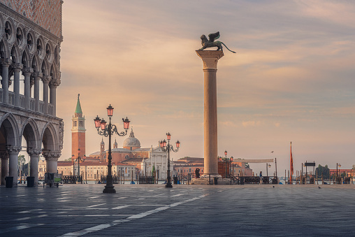 Venice, Italy. Beautiful sunrise at the San Marco square with Column di San Marco and Doges Palace in Venezia, Italia. Travel destination