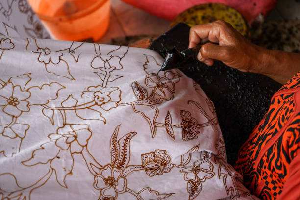 istock The technique of making batik by writing using a canting tool. Canting consists of nyamplung, cucuk, gagang or handles made of copper, bamboo and wax. Cecek, loron, telon, prapat, telon, liman, byok. 1368967396