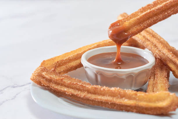 istock Mexican churros served on a homemade plate. 1368967593