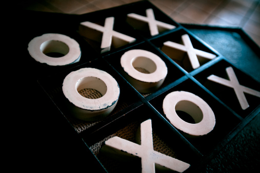 Tic Tac Toe gameboard. X win! O lose... (500 iso Cannon 5D Mark 2, Natural Light, Low Key, Cross Process)
