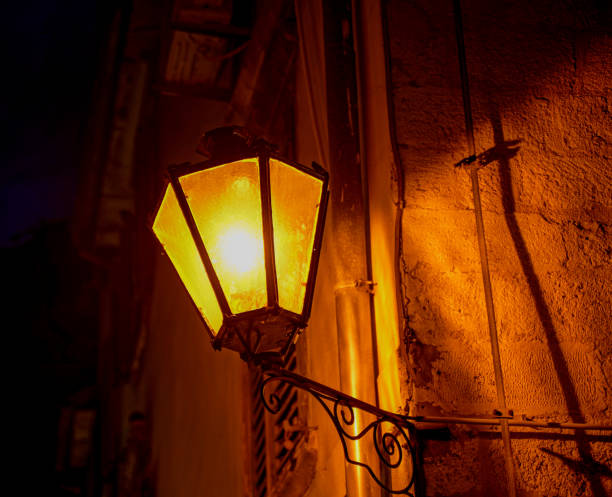 istock Lamp. A lantern illuminates the street. 1368969580
