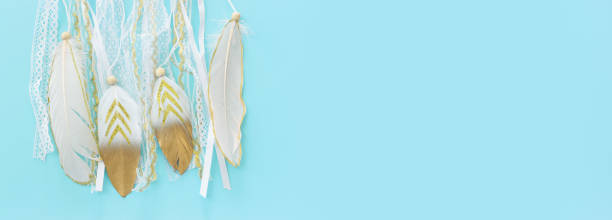 istock Image of white dream catcher over pastel blue background. Top view 1368970020