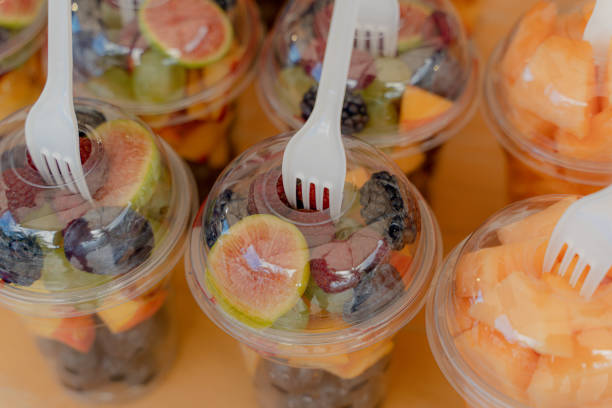 istock Fruit. Assorted fruits in a plastic glass. 1368971129