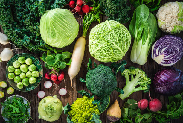 Crucifers vegetables assortment as cabbage, broccoli, cabbage, turnip, kale, romanesco, radish, arugula