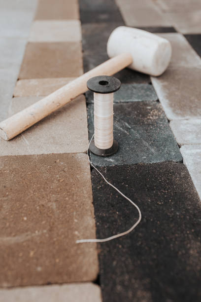 istock Marking cord and rubber mallet on paving slabs 1368975938